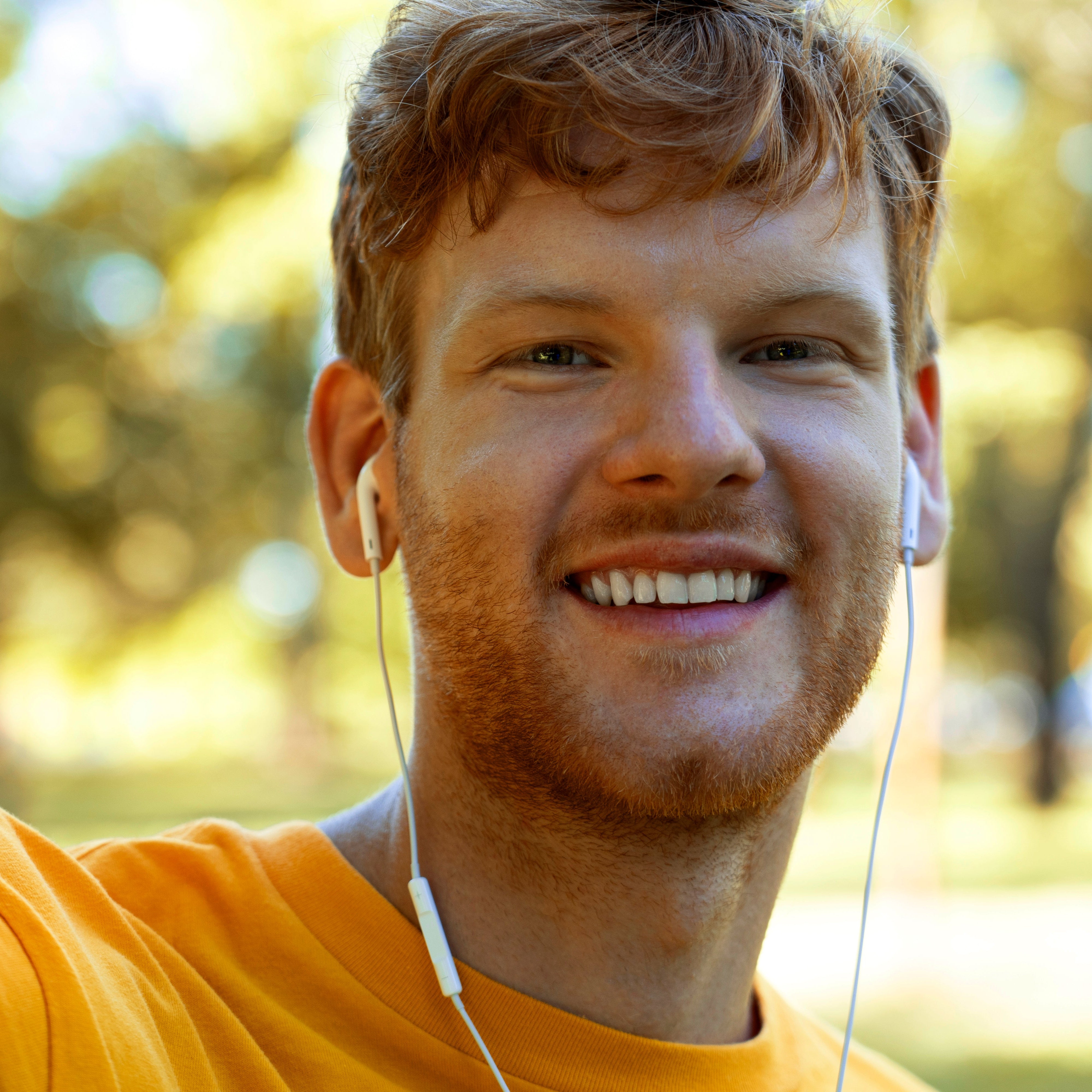 files/front-view-smiley-man-with-earphones.jpg